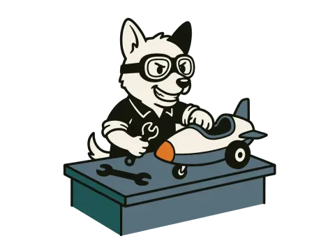 The Sidecar dog at a workbench building a small prototype vehicle